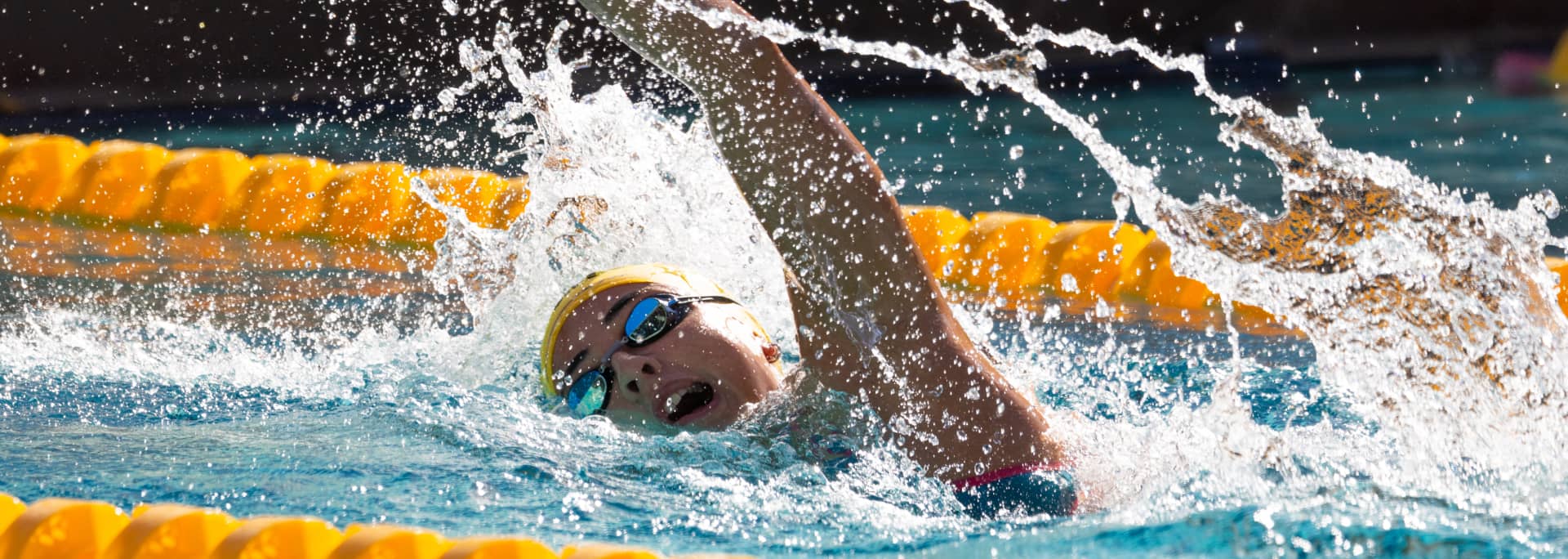 A female ASU swimming is shown in the middle of a race.