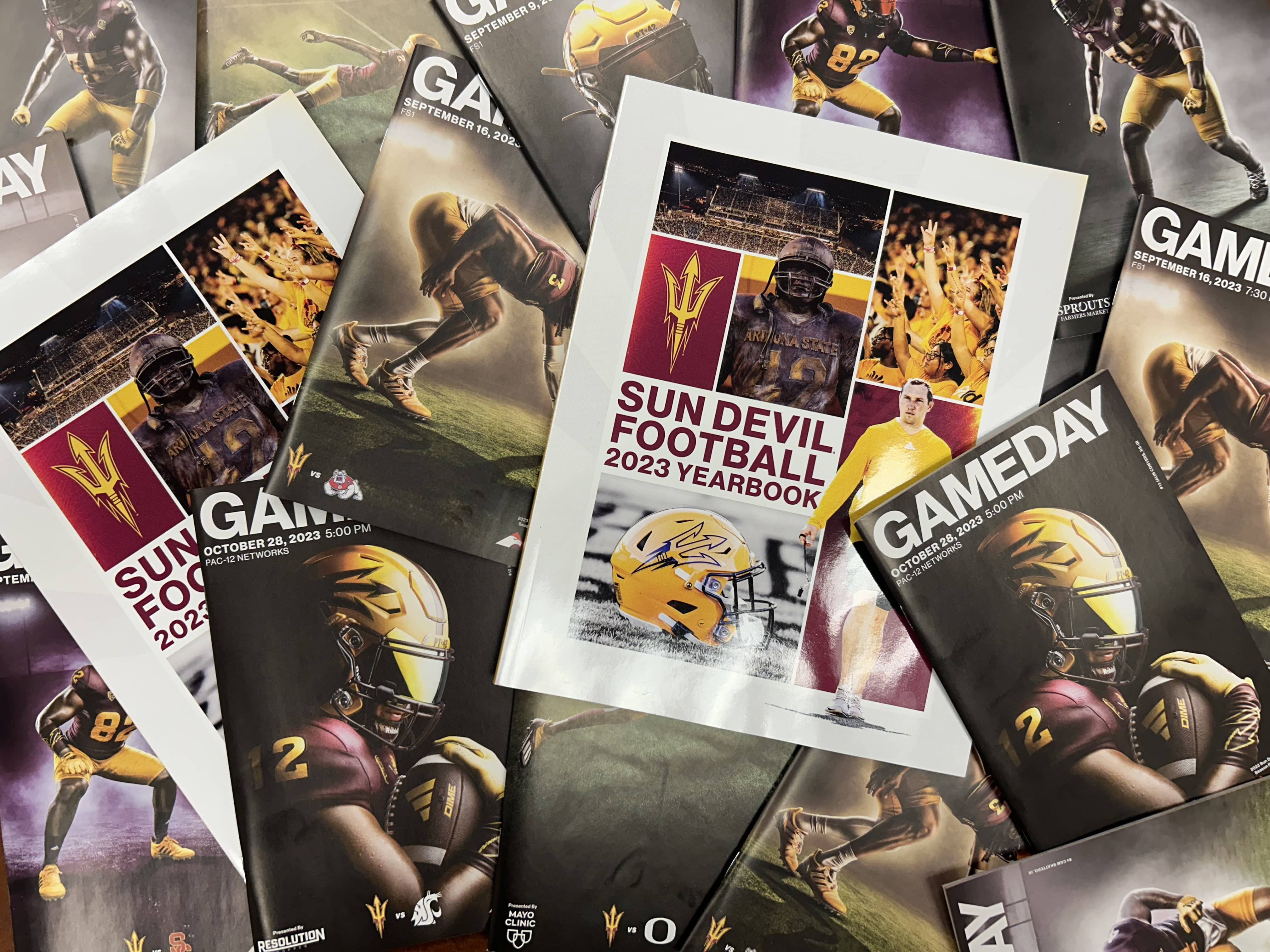 Game Day magazine covers spread out