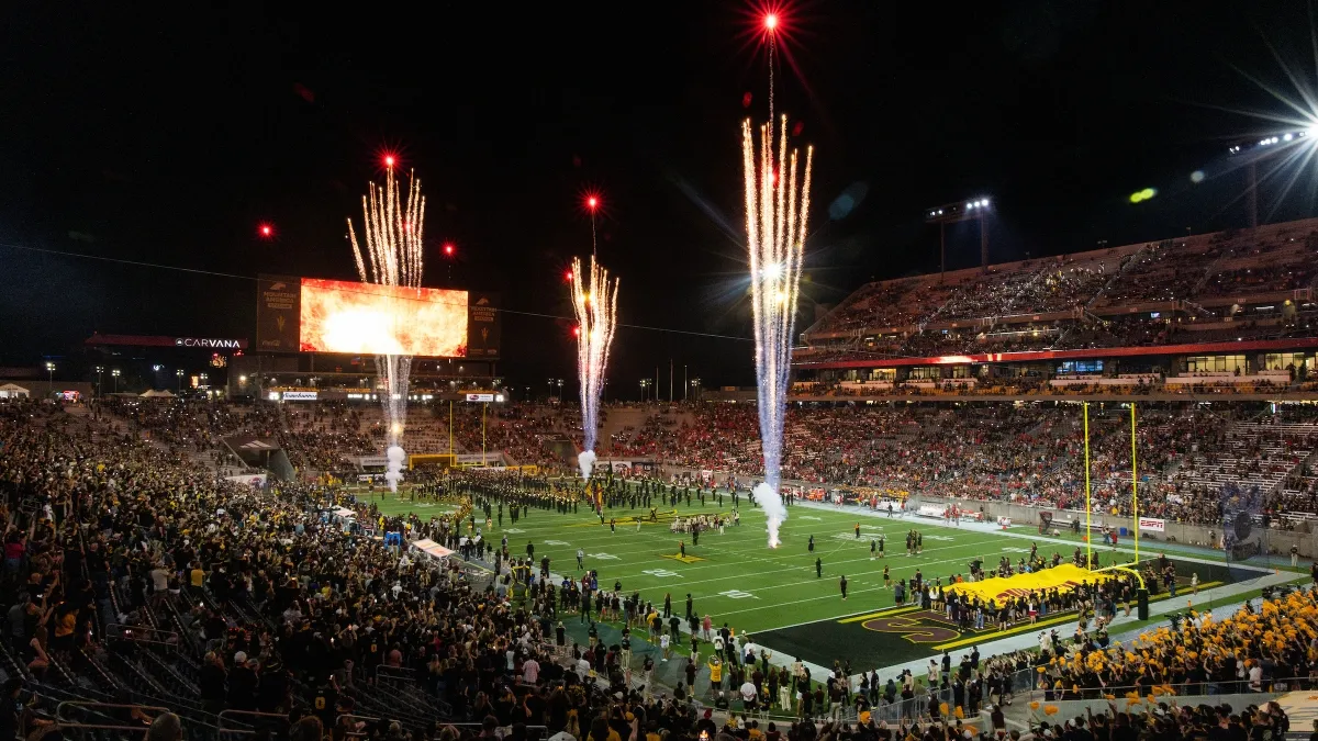 Fireworks shooting off from ASU's football field during a full game at night Fireworks shooting off from ASU's football field during a full game at night