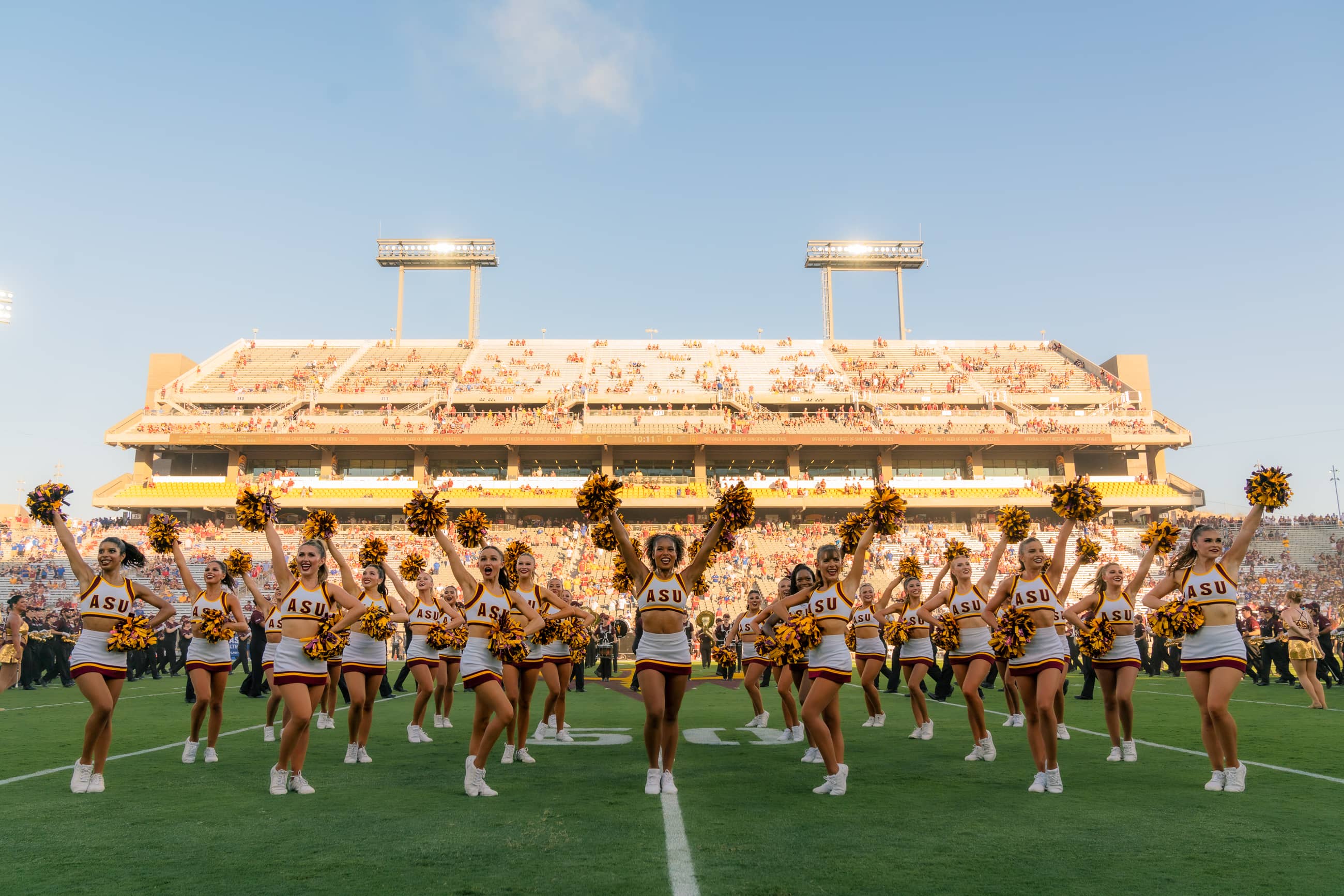 ASU Dance team picture on the field in uniforms