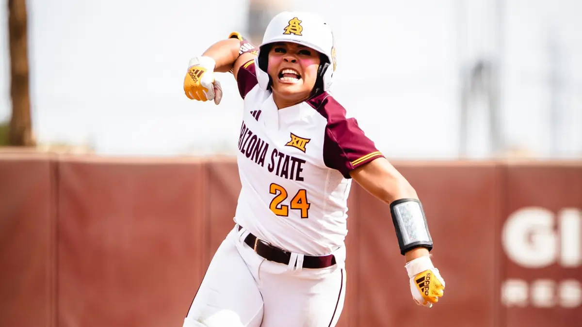 Ashleigh Mejia pumps her fist rounding second following her game-tying 3-run home run.