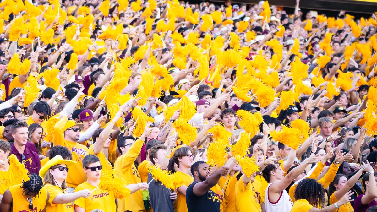 Football student section cheers during a game Football student section cheers during a game