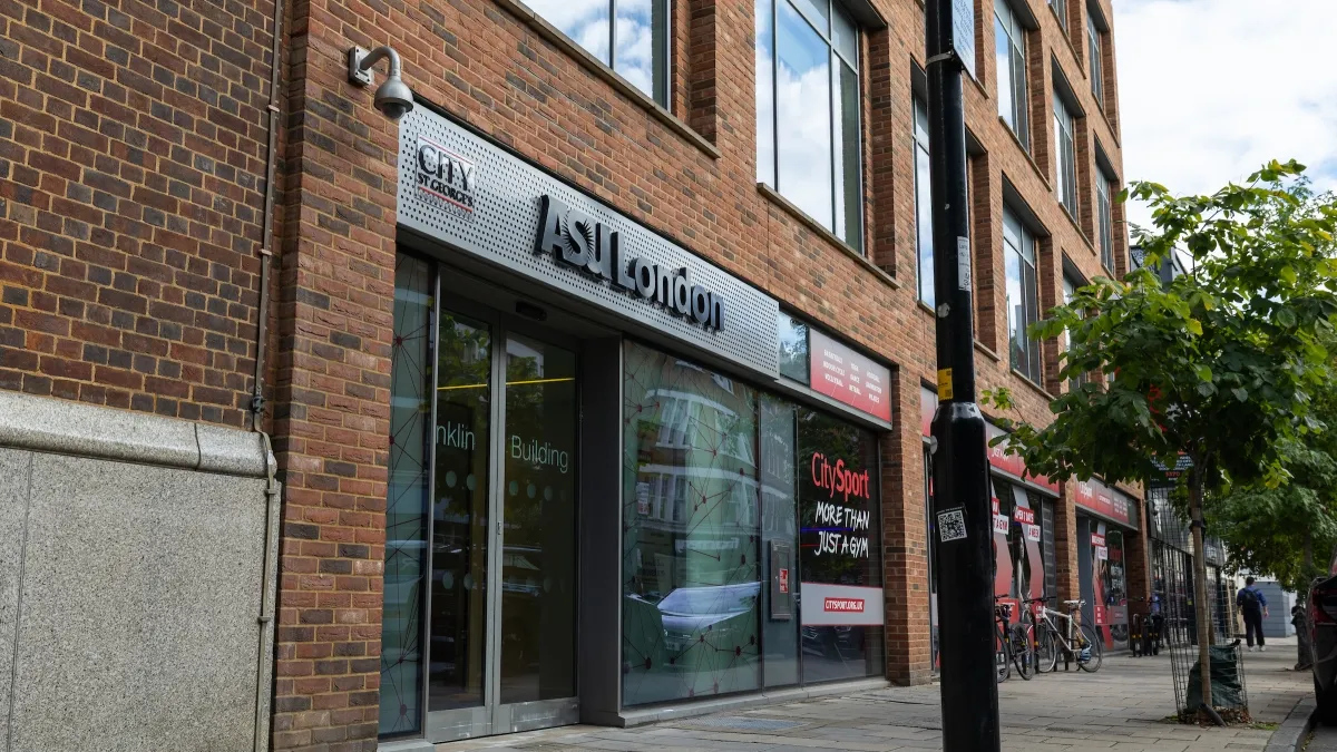Outside of a building on an London street that says ASULondon over the glass door