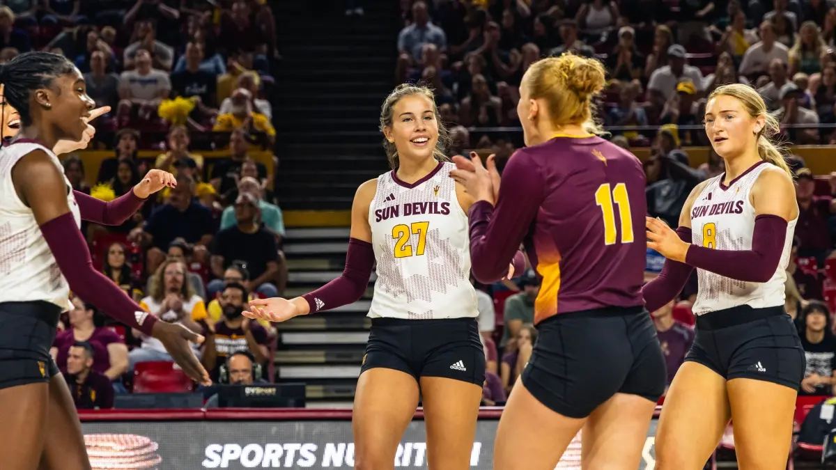 Brynn Covell and her teammates celebrate winning a rally against BYU in Desert Financial Arena. Brynn Covell and her teammates celebrate winning a rally against BYU in Desert Financial Arena.