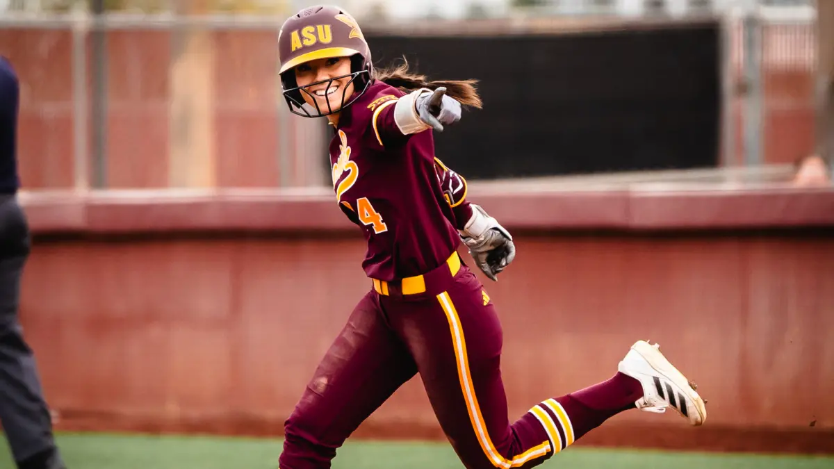 Tanya Windle circles the bases after her home run