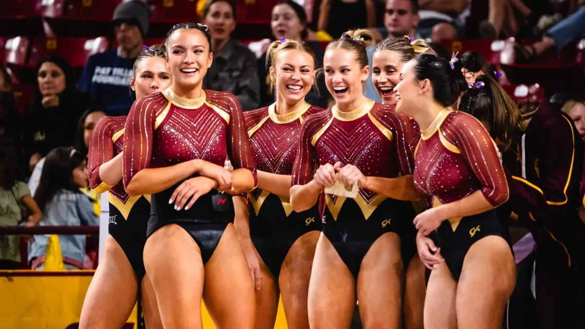 Four gymnasts smiling and laughing Four gymnasts smiling and laughing