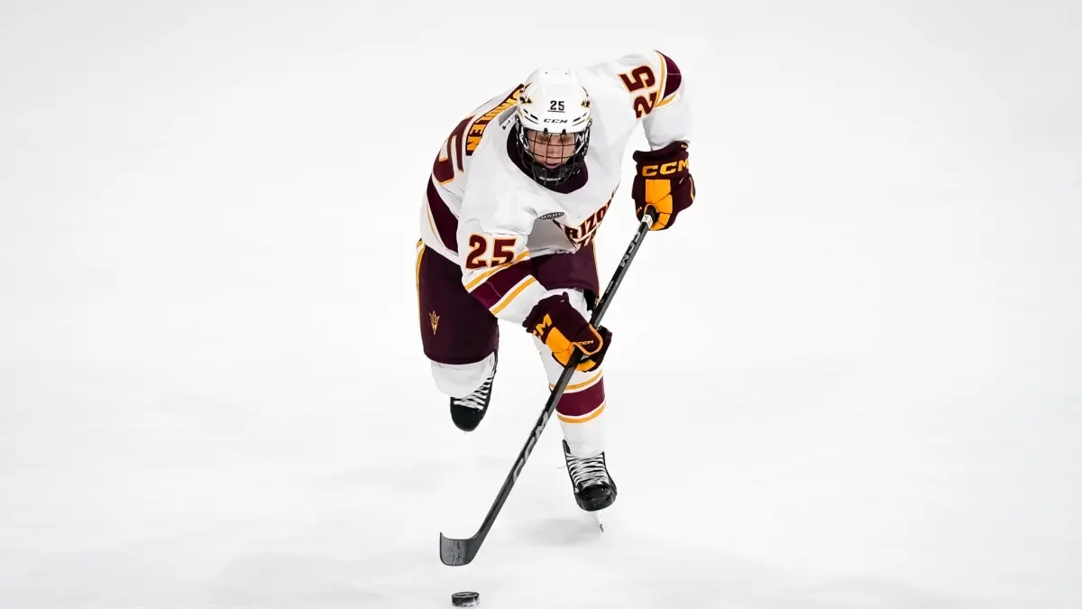 Kyle Smolen Skates with the puck