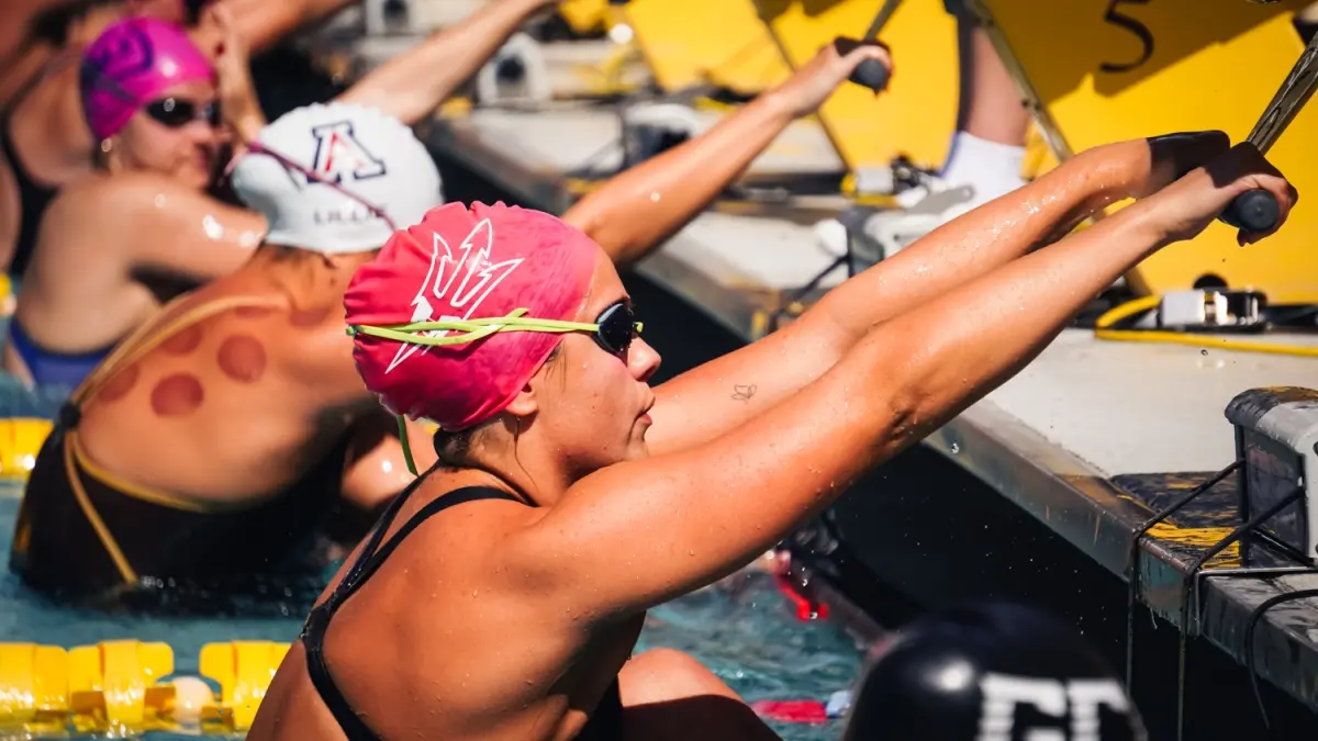 ASU Swimming lining up before swimming the backstroke.