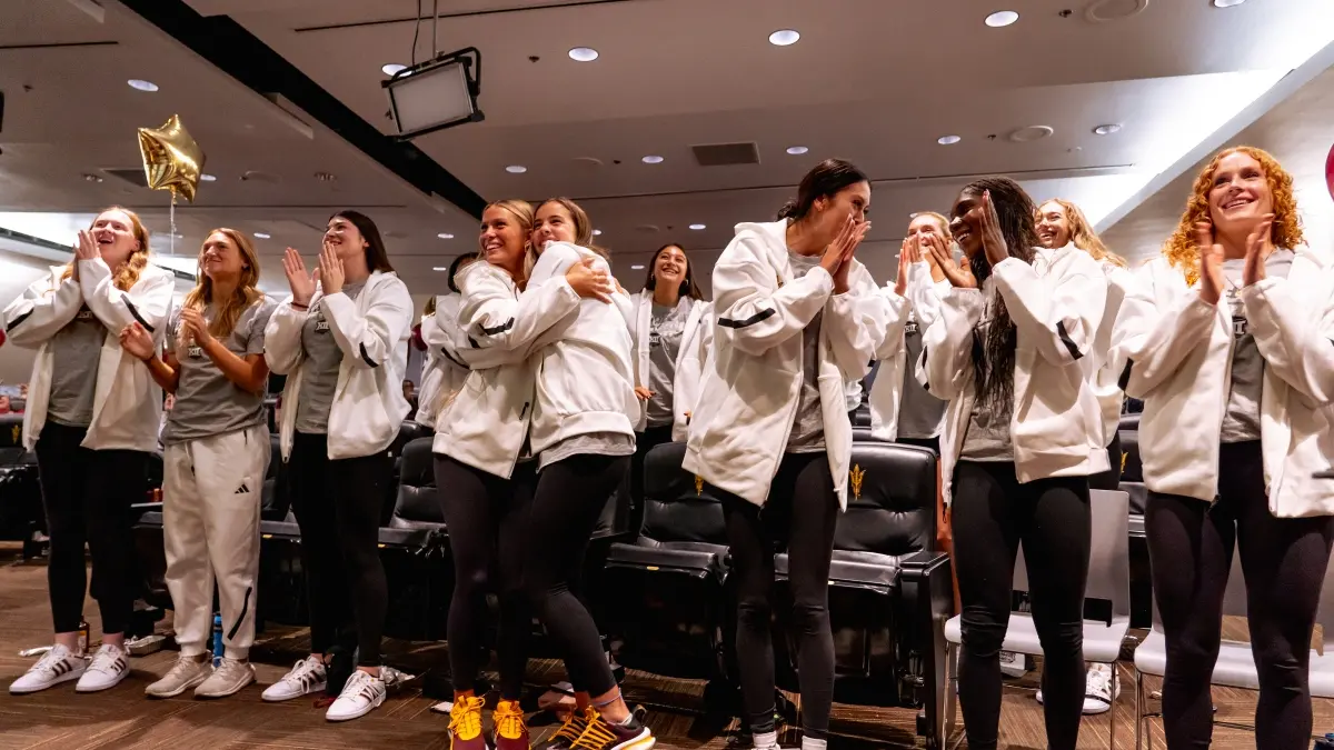 Volleyball players celebrating hearing their name called for the NCAA Tournament.