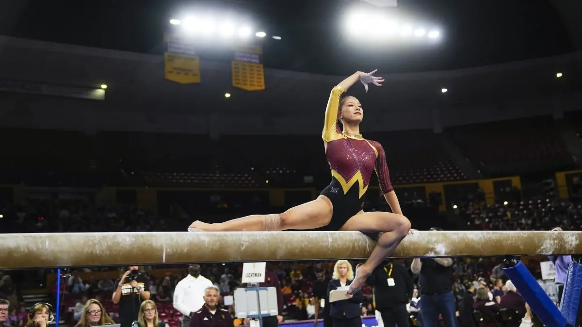 Caroline Lichtman poses on beam Caroline Lichtman poses on beam