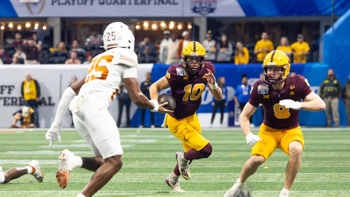 Sam Leavitt scrambles against Texas during the Peach Bowl