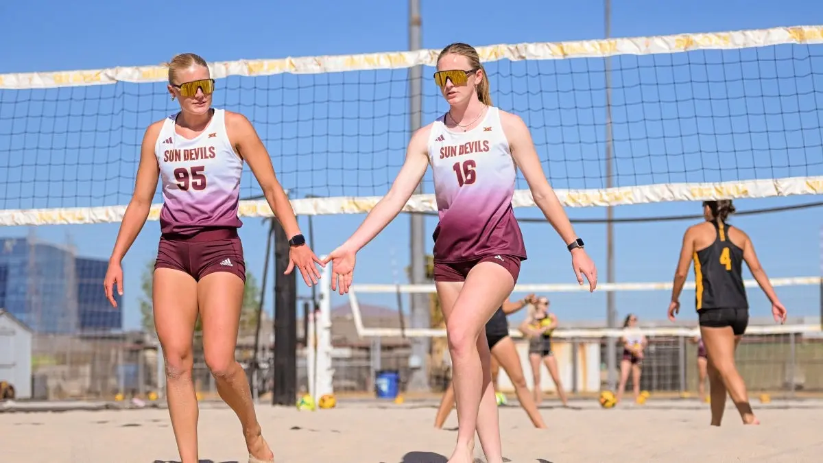 Daniella Kensinger and Ava Williamson high fiving Daniella Kensinger and Ava Williamson high fiving