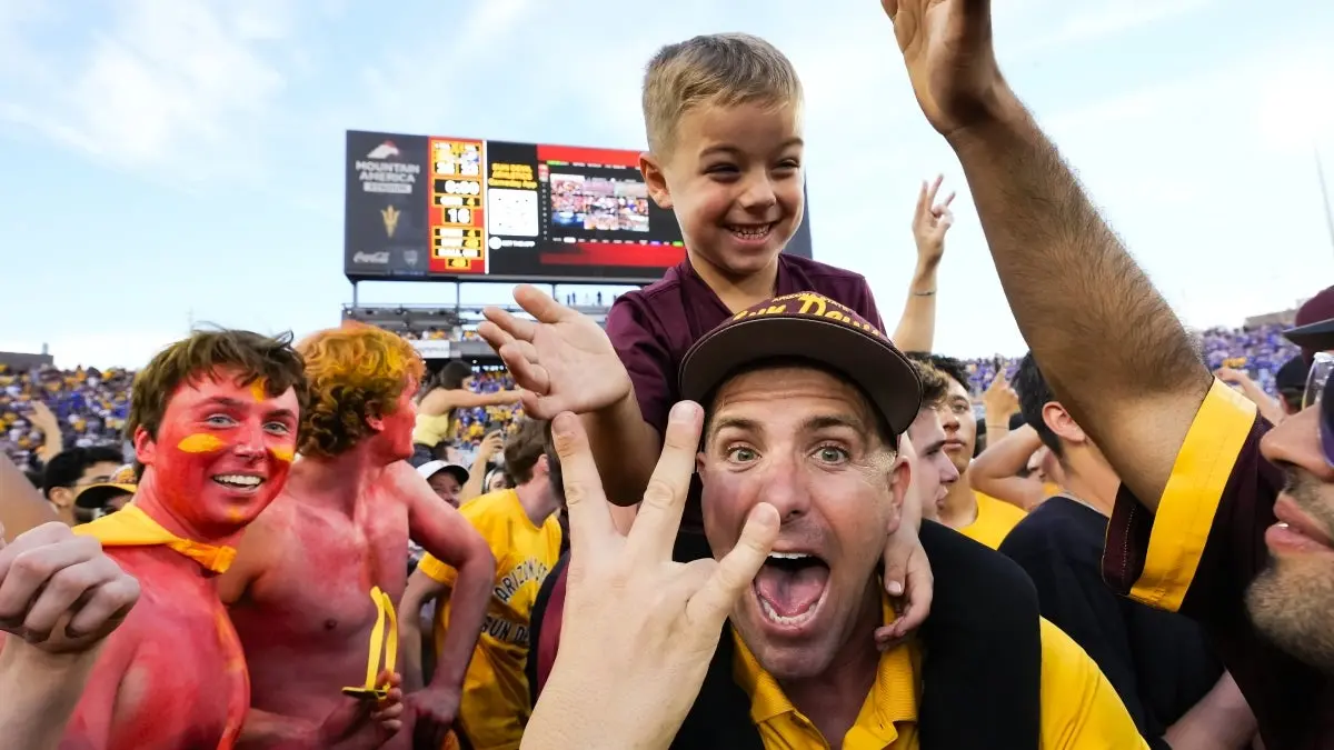 Family storms field after defeating BYU Family storms field after defeating BYU