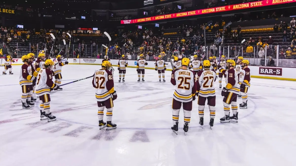 Image from ASU News huddle of ice hockey players