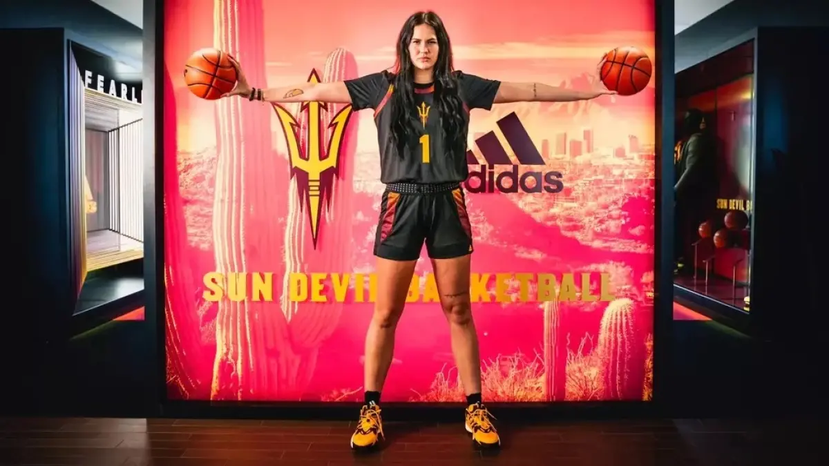 The Sun Devils add size in the post with a local tie when Kennedy Basham transferred from Oregon.<br />
basketball player holding two balls in each hand