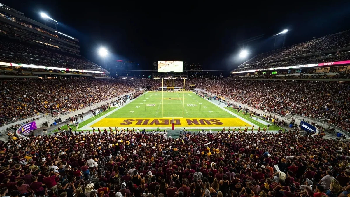 Image from ASU News full view of the football field and filled bleachers