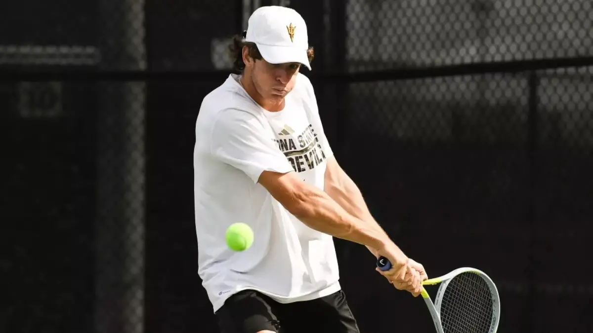 male tennis player watching ball he just hit with his racket male tennis player watching ball he just hit with his racket