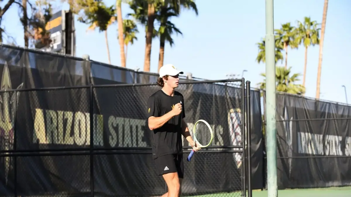 male tennis player holding a closed fist up male tennis player holding a closed fist up