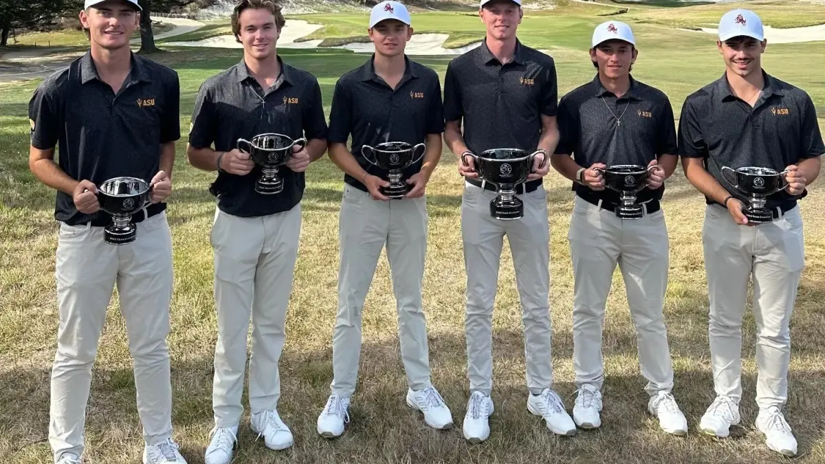 six male golf players holding awards