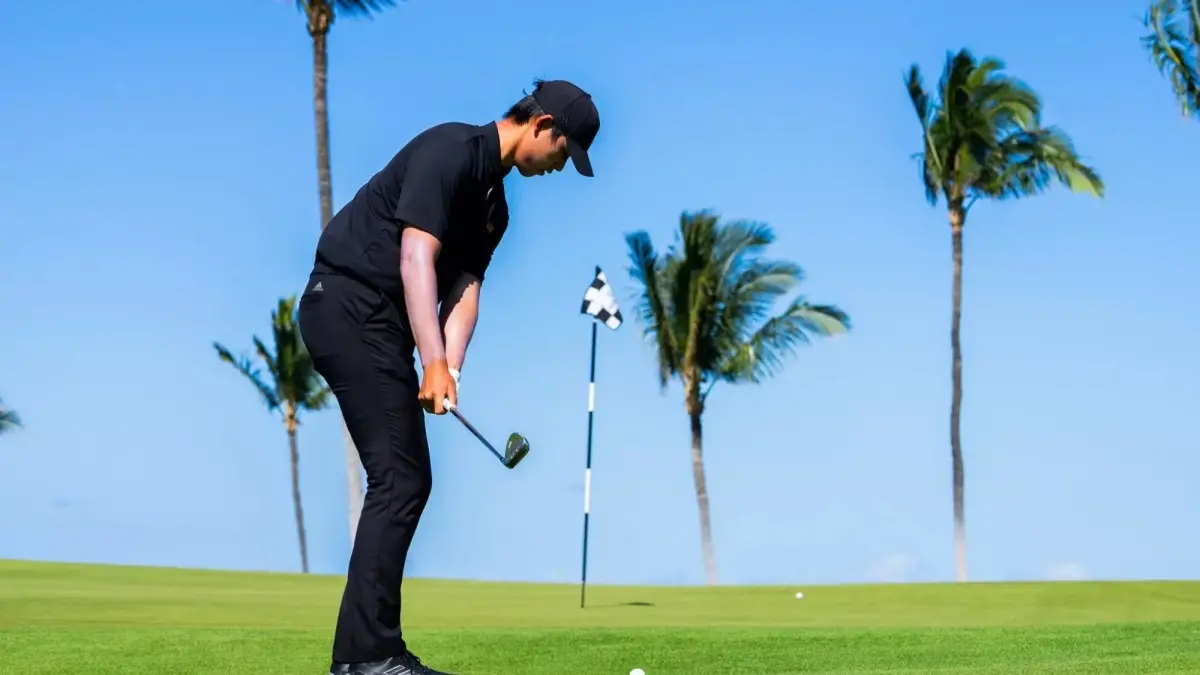 male golf player swinging club