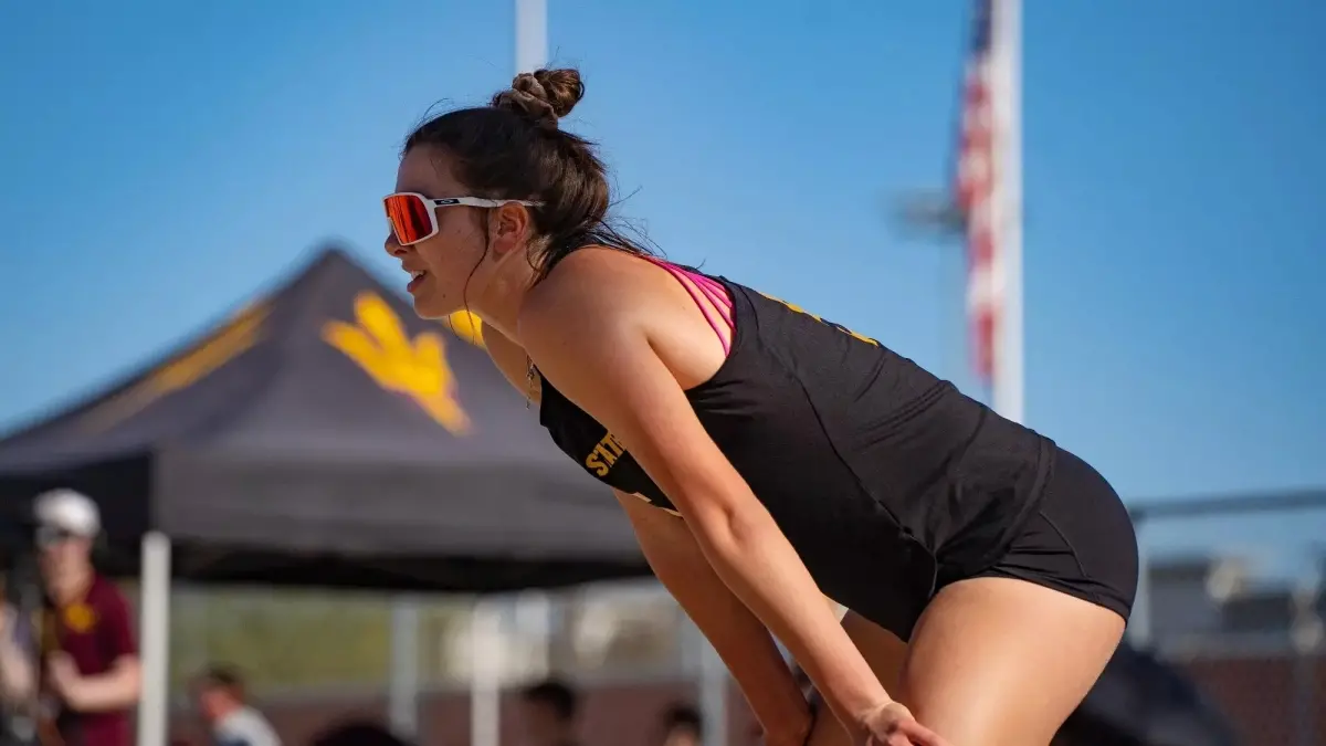 beach volleyball player bent over with hands on knees beach volleyball player bent over with hands on knees