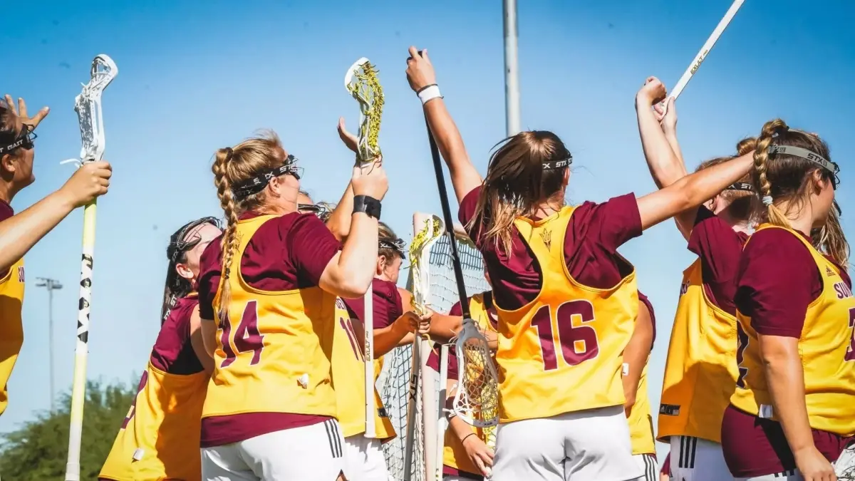 lacrosse players holding lacrosse sticks lacrosse players holding lacrosse sticks