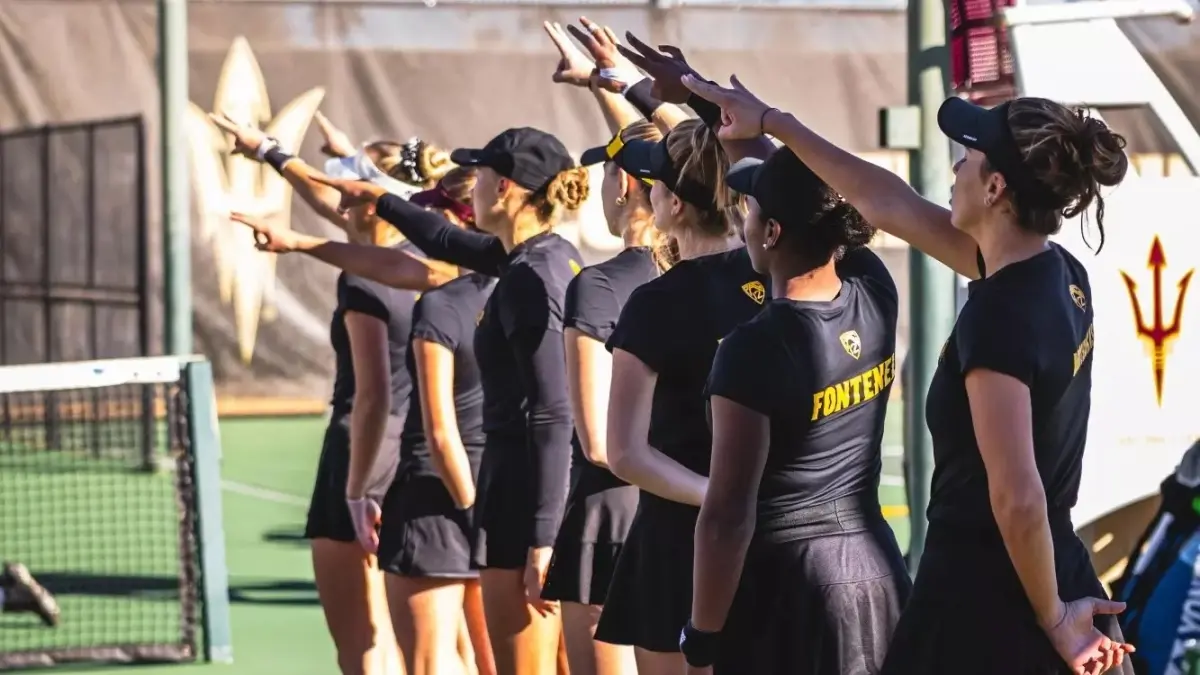 seven women's tennis holding up forks up seven women's tennis holding up forks up