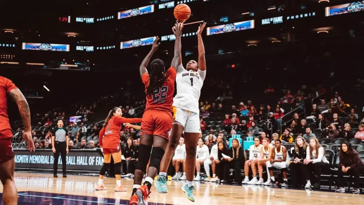 Kadidia Toure scored 22 points and pulled down nine rebounds in last year's Hall of Fame Series contest against Fresno State.<br />
basketball players on court