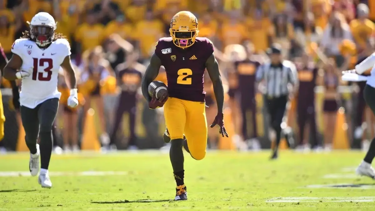 Image from ASU News two ASU football players on the field