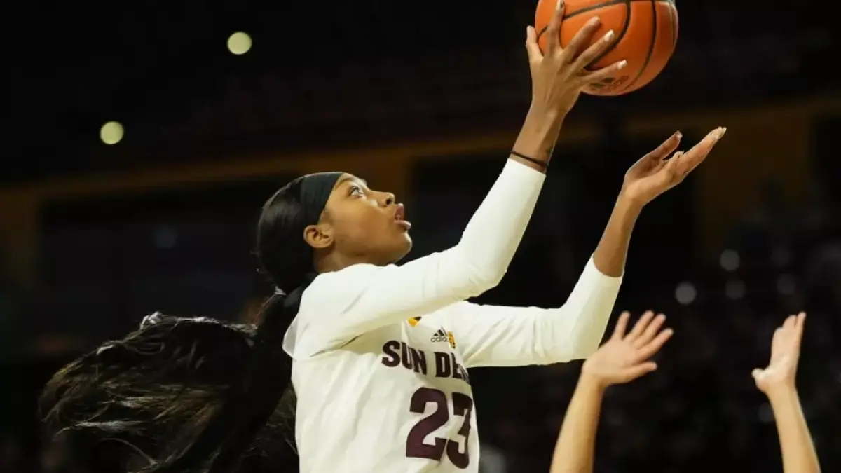 Image from ASU News woman about to put basketball in hoop