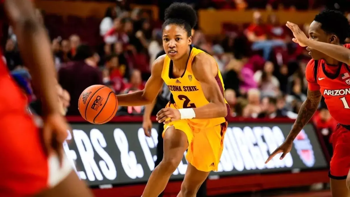 woman dribbling ball with other woman playing defense woman dribbling ball with other woman playing defense