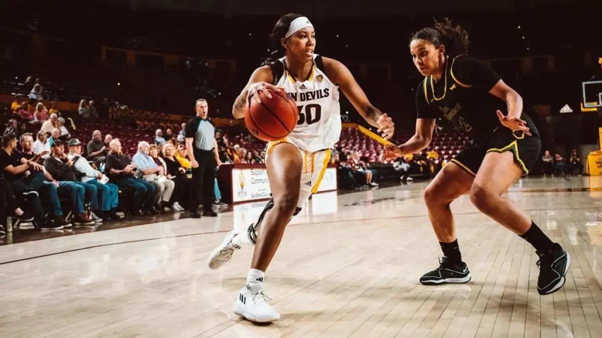 woman dribbling ball with other woman playing defense woman dribbling ball with other woman playing defense