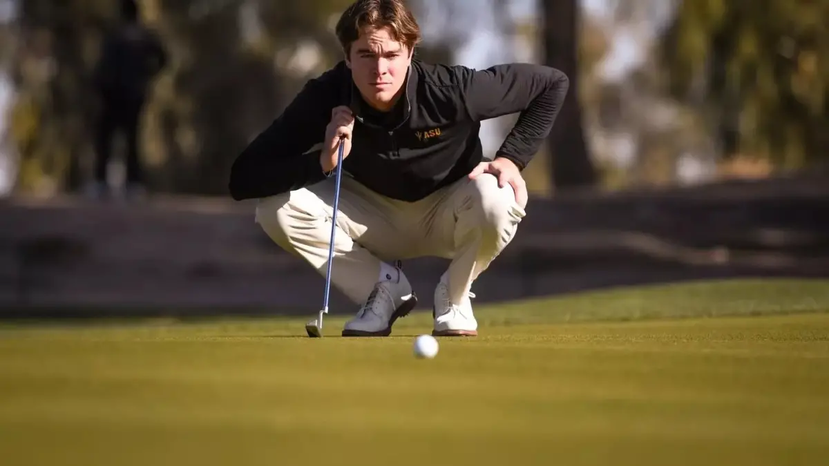 male golfer watching golf ball male golfer watching golf ball