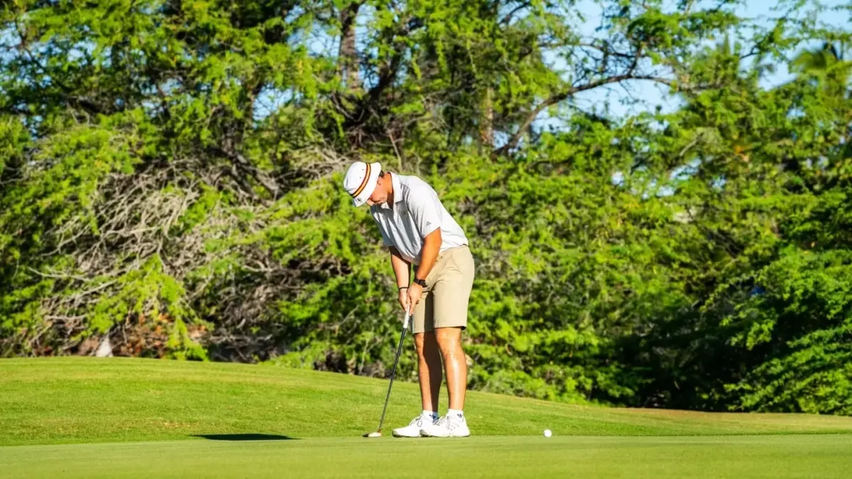 male golf player swinging club