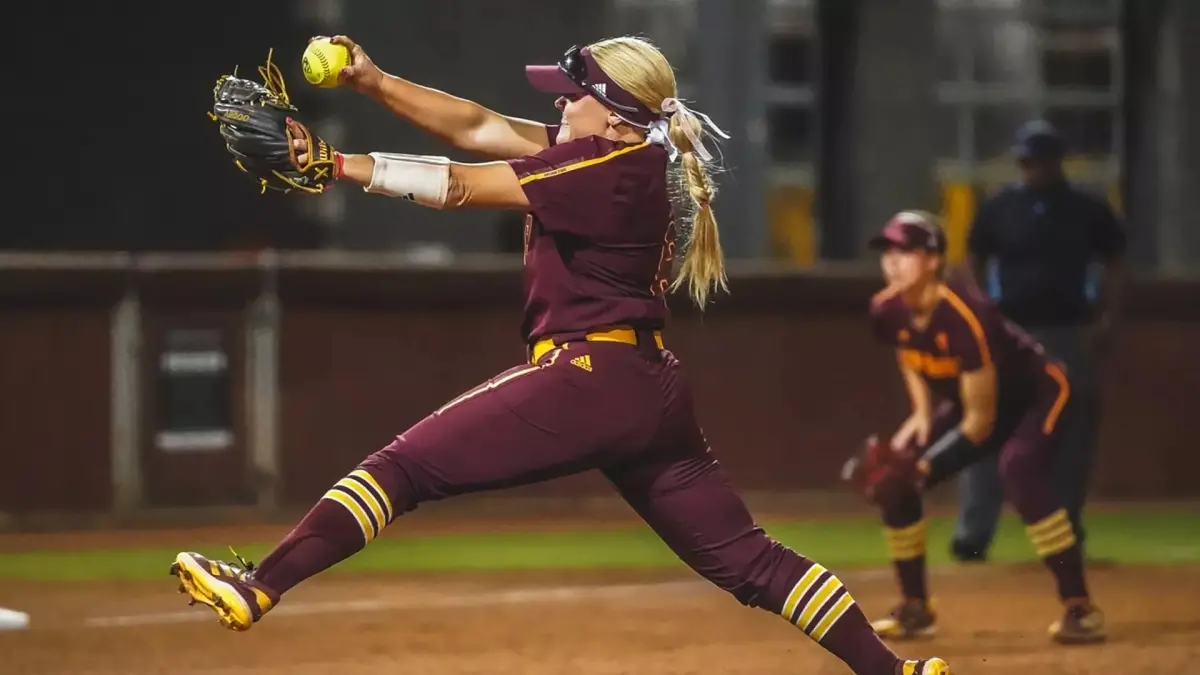 softball player throwing ball softball player throwing ball