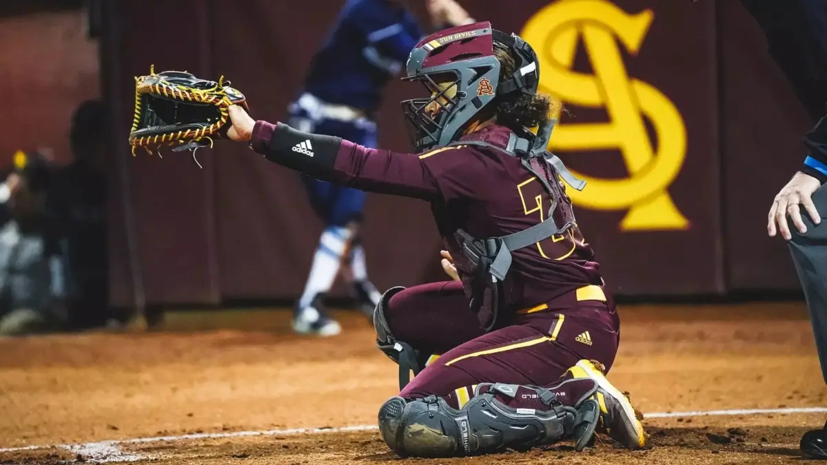 softball player holding mitt softball player holding mitt
