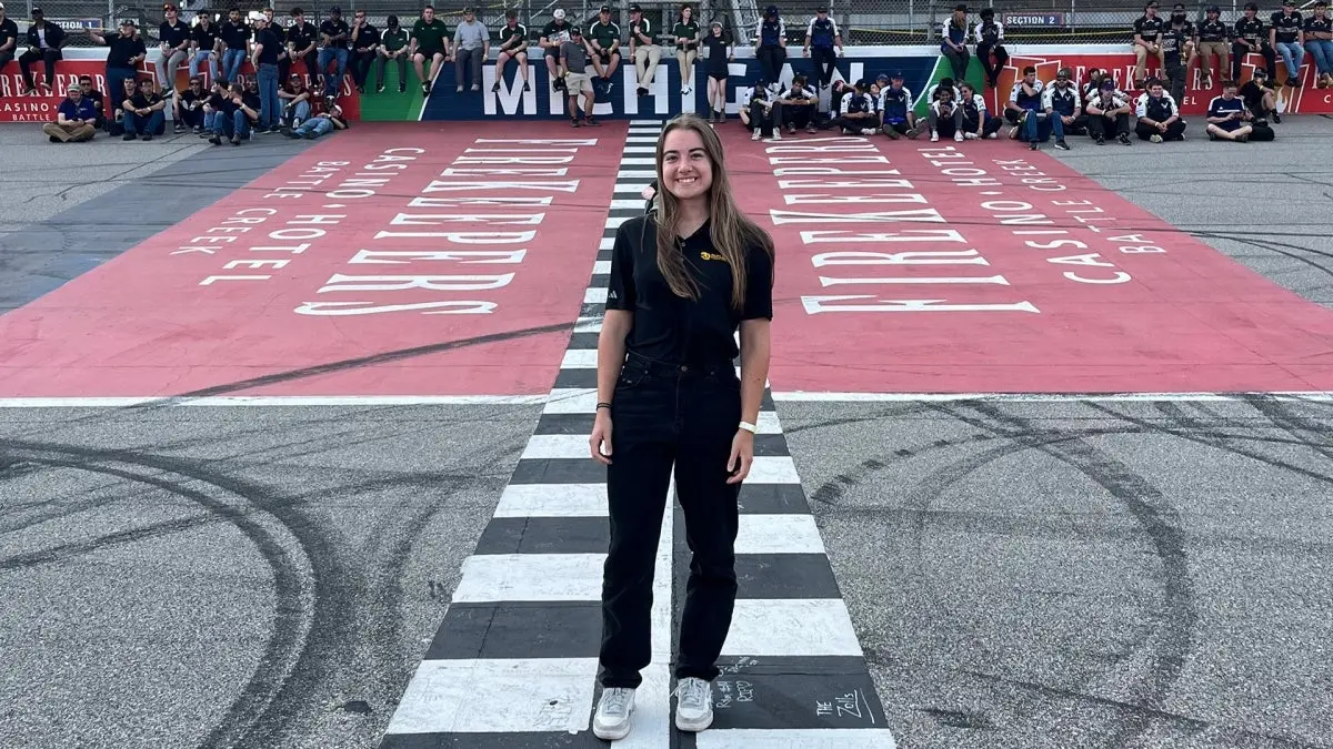 Woman standing on racing track Woman standing on racing track