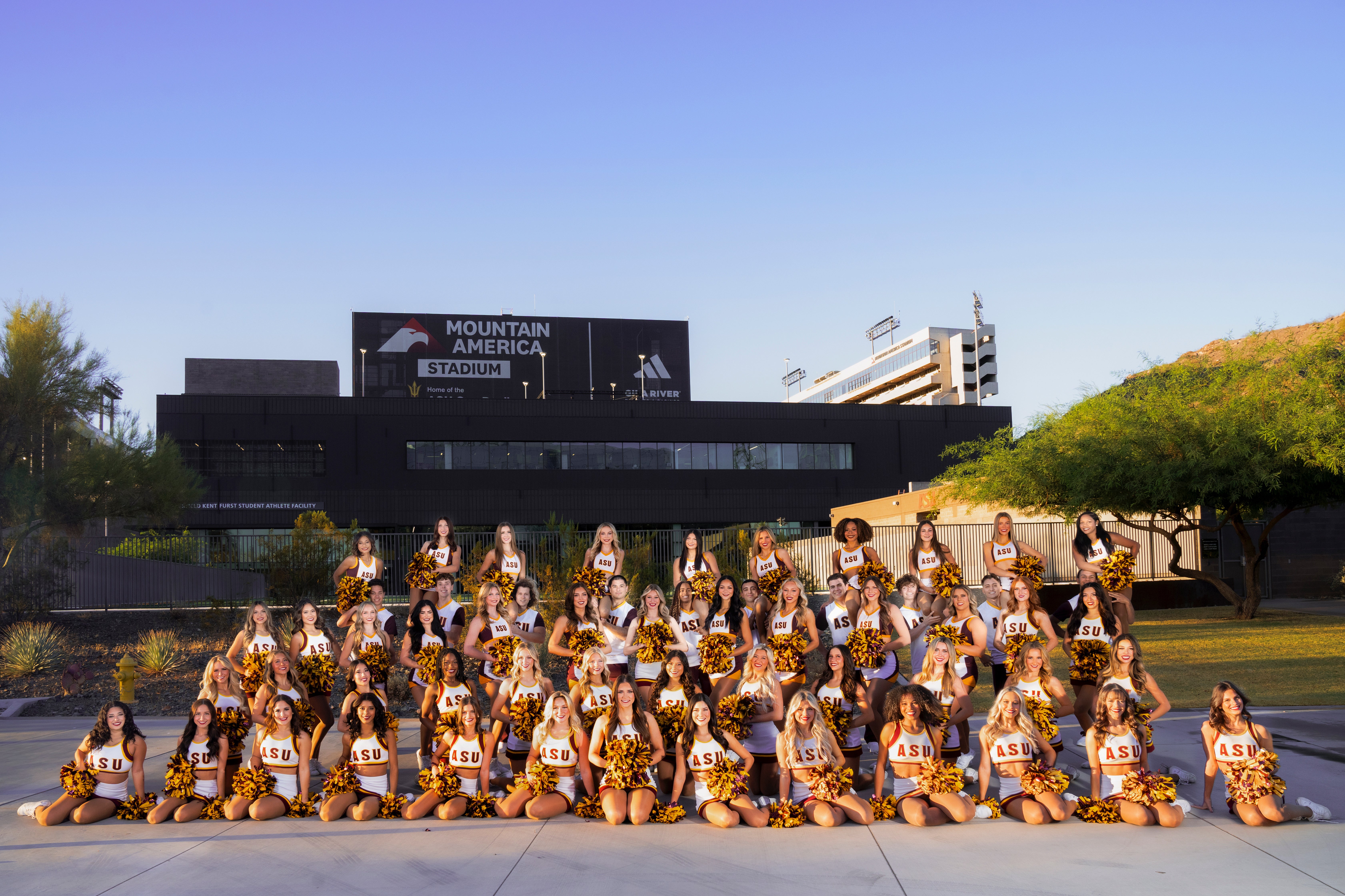 Spirit Squad posing for team photo in front of Mountain America Stadium