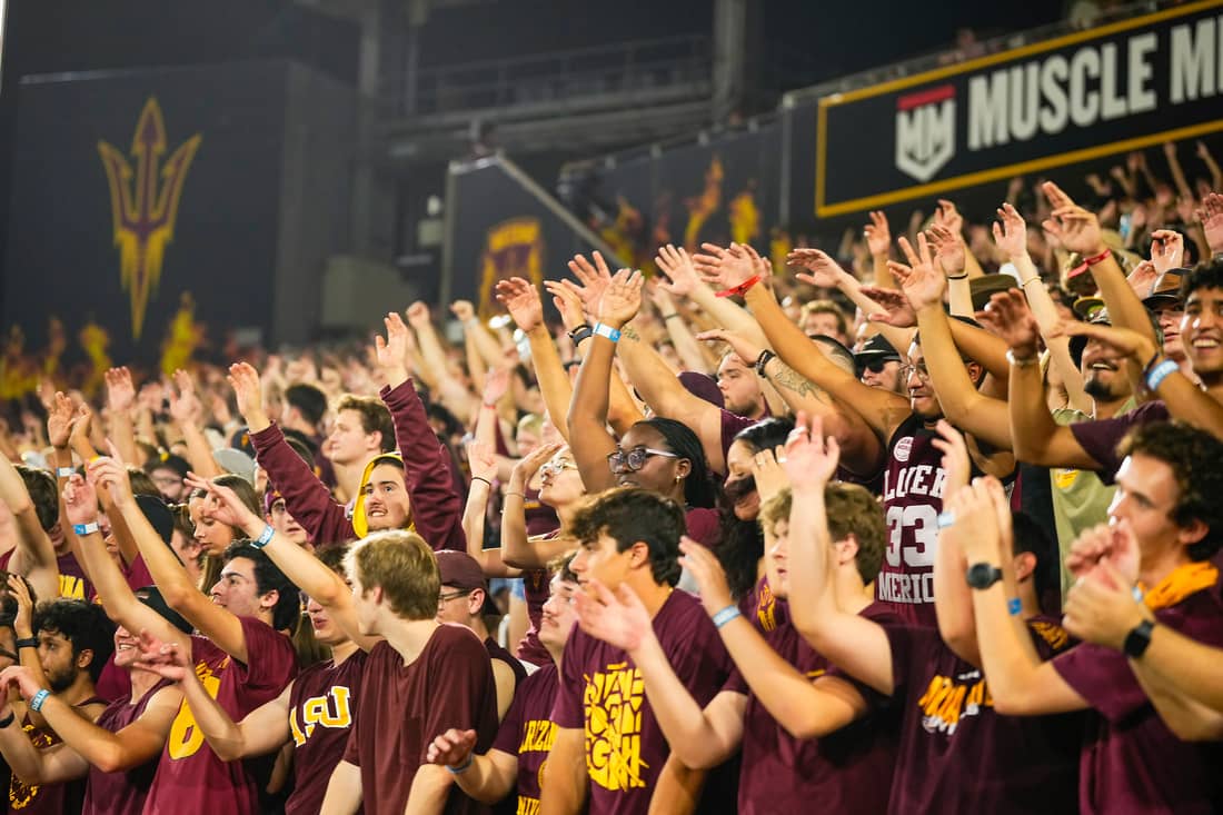 Sun Devil student fans cheering at sporting event