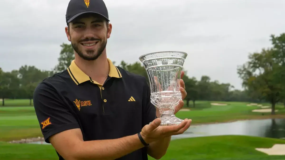 Josele Ballester holding trophy for winning Illini Invitational