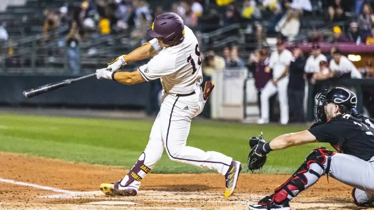 Image from ASU News baseball player holding bat