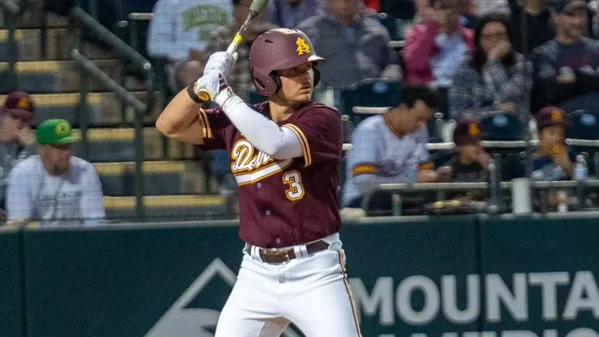 Image from ASU News baseball player holding bat