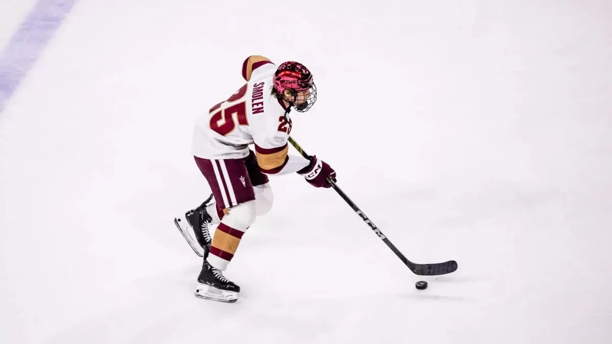 Image from ASU News hockey player on ice with hockey stick