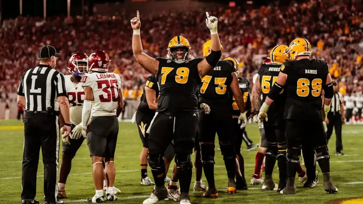 Image from ASU News football players on field