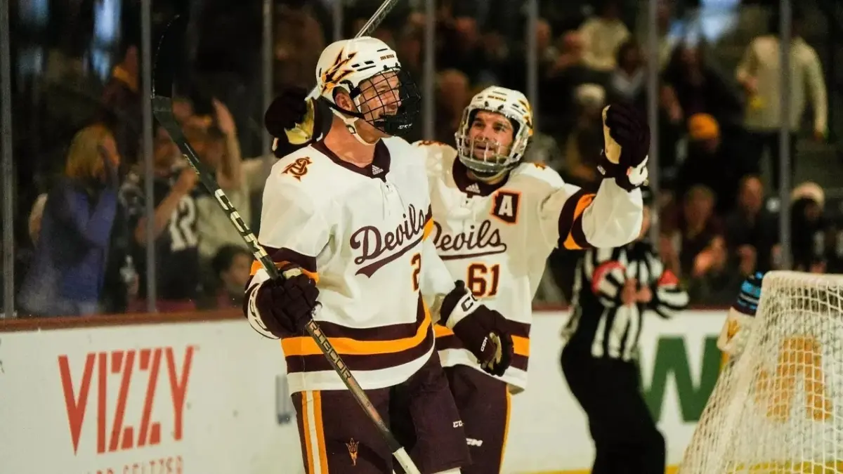 two ice hockey players on ice talking two ice hockey players on ice talking