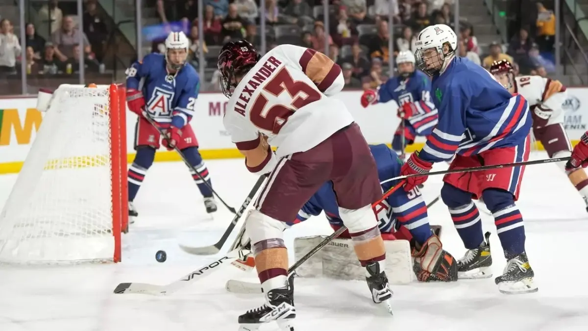 group of ice hockey players in a huddle trying to throw puck in goal