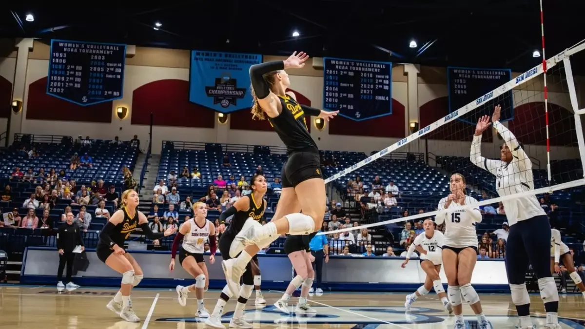 volleyball player jumping to hit ball volleyball player jumping to hit ball