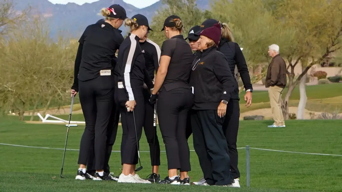 womens golf team in a huddle womens golf team in a huddle