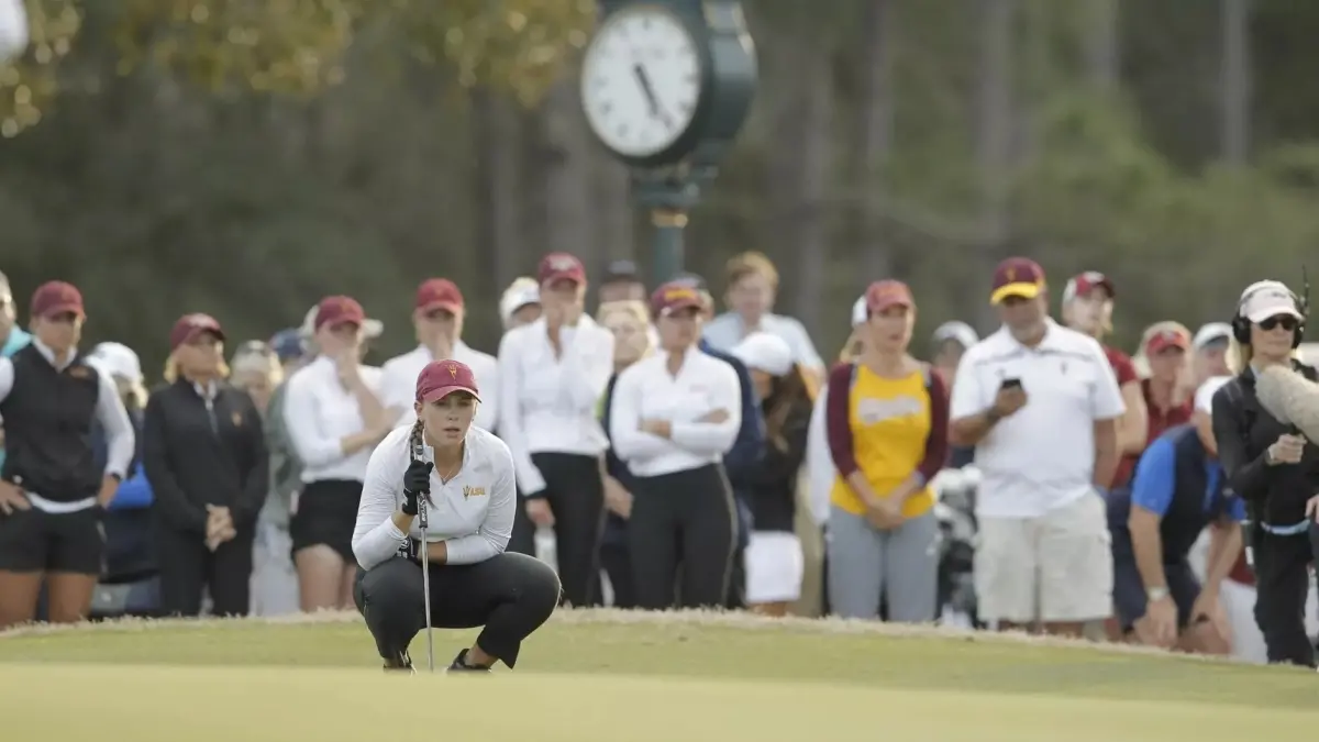 woman watching golf ball woman watching golf ball