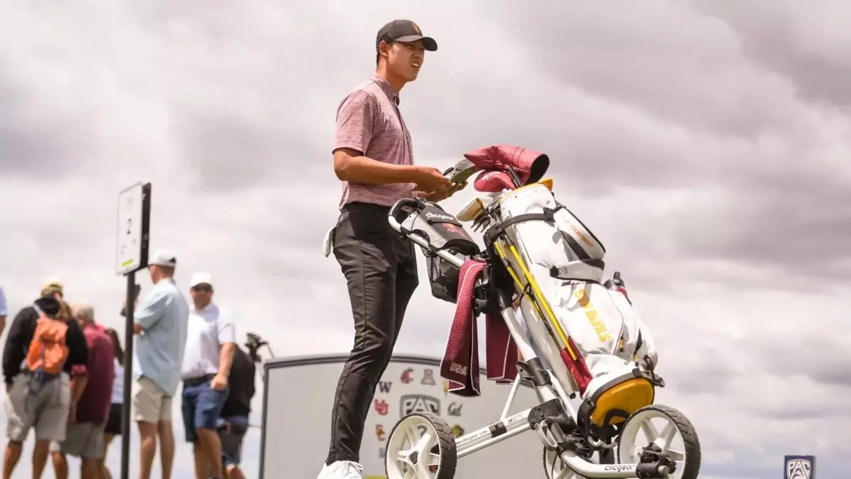 male golf player next to golf bag